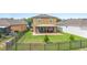 View of backyard with covered patio and outdoor dining set at 2254 Canyon Breeze Ave, Kissimmee, FL 34746