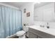 Bathroom featuring a single sink vanity, toilet, and shower/tub with modern fixtures and decorations at 2254 Canyon Breeze Ave, Kissimmee, FL 34746