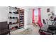 Bedroom with a dedicated desk space and organized shoe rack with a neutral color palette at 2254 Canyon Breeze Ave, Kissimmee, FL 34746