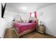 Bedroom featuring a silver bed frame, matching dresser and nightstands, and plush carpeting at 2254 Canyon Breeze Ave, Kissimmee, FL 34746