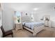 Bright bedroom featuring a tufted headboard, matching nightstands and dresser with neutral tones at 2254 Canyon Breeze Ave, Kissimmee, FL 34746
