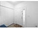 Bright entryway featuring a white door with decorative glass and closet for storing coats at 2254 Canyon Breeze Ave, Kissimmee, FL 34746