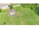 Aerial view of green community playground with benches at 2254 Canyon Breeze Ave, Kissimmee, FL 34746
