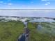 A beautiful waterfront property with a dock in a lush, natural setting at 2921 Lake Tohopekaliga Blvd, Kissimmee, FL 34746