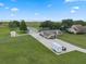 Sprawling property with lush lawn, multiple outbuildings, and ample parking space at 2921 Lake Tohopekaliga Blvd, Kissimmee, FL 34746