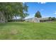 Spacious backyard with pool, boat storage, and a lush green lawn at 2921 Lake Tohopekaliga Blvd, Kissimmee, FL 34746