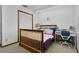 Bedroom boasts soft lighting, adjacent desk, and closet with shutter doors at 2921 Lake Tohopekaliga Blvd, Kissimmee, FL 34746