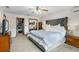 Well-lit bedroom with a plush king-size bed, closet, and dresser, offering comfortable living at 2921 Lake Tohopekaliga Blvd, Kissimmee, FL 34746