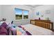 Bright bedroom with a view and soft decor creates a cozy and inviting atmosphere at 2921 Lake Tohopekaliga Blvd, Kissimmee, FL 34746