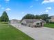 Spacious property with an additional outbuilding, fenced yard, and paved driveway at 2921 Lake Tohopekaliga Blvd, Kissimmee, FL 34746