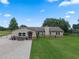 Well-maintained single-story home with inviting front patio and manicured lawn at 2921 Lake Tohopekaliga Blvd, Kissimmee, FL 34746