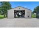 Large metal garage with a brick paver floor is ideal for storage and projects at 2921 Lake Tohopekaliga Blvd, Kissimmee, FL 34746