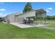 Property includes a large detached garage and covered parking on a green lawn at 2921 Lake Tohopekaliga Blvd, Kissimmee, FL 34746