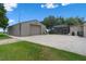 Large garage with ample parking space and an adjacent screened-in pool area at 2921 Lake Tohopekaliga Blvd, Kissimmee, FL 34746