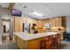 Kitchen with stainless steel appliances, wood cabinets, and granite countertops at 2921 Lake Tohopekaliga Blvd, Kissimmee, FL 34746