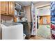 Convenient laundry room with modern washer and dryer appliances and shelving at 2921 Lake Tohopekaliga Blvd, Kissimmee, FL 34746