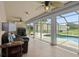 Cozy living room with tiled floor and views of the pool and garage at 2921 Lake Tohopekaliga Blvd, Kissimmee, FL 34746