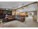 Spacious living room with open kitchen concept, track lighting, and comfortable leather seating at 2921 Lake Tohopekaliga Blvd, Kissimmee, FL 34746