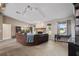 Comfortable living room showcasing a brick fireplace, neutral carpeting, and plenty of natural light at 2921 Lake Tohopekaliga Blvd, Kissimmee, FL 34746