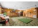 Spacious recreation room featuring a bar, golf simulator, and comfortable seating area at 2921 Lake Tohopekaliga Blvd, Kissimmee, FL 34746