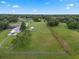 Aerial view of the spacious yard, showcasing the detached garage and fence-lined boundary at 2921 Lake Tohopekaliga Blvd, Kissimmee, FL 34746