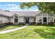 Charming single-story home with Tudor accents, fresh landscaping, and inviting entryway at 3015 Riviera Bay Ct, Oviedo, FL 32765