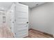 Hallway featuring wood-look floors and white doors at 3015 Riviera Bay Ct, Oviedo, FL 32765