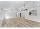 Open-concept living area with vaulted ceilings, modern fixtures, and abundant natural light at 3015 Riviera Bay Ct, Oviedo, FL 32765