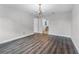 Spacious living room with decorative chandelier, pristine white walls and doorway views at 3015 Riviera Bay Ct, Oviedo, FL 32765