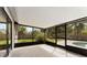 Enclosed patio with views of the fenced backyard and pool at 3015 Riviera Bay Ct, Oviedo, FL 32765