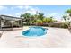 Inviting pool area with mature landscaping, screened patio, and privacy fence at 3015 Riviera Bay Ct, Oviedo, FL 32765
