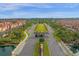 Aerial view of gated community entrance with lush landscaping, palm trees, and well-maintained roads at 3061 Beach Palm Ave, Kissimmee, FL 34747
