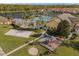 Community amenities with pool, volleyball, playground, and lush landscape, close to the lake at 3061 Beach Palm Ave, Kissimmee, FL 34747