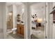 Modern bathroom featuring a glass-enclosed shower, with a view into the main bedroom at 3061 Beach Palm Ave, Kissimmee, FL 34747