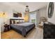 Beautiful bedroom with a large bed, unique lighting, neutral color scheme, and stylish decor at 3061 Beach Palm Ave, Kissimmee, FL 34747