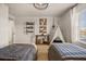 Shared bedroom with twin beds, decorative shelves, wall decor, and a charming tent at 3061 Beach Palm Ave, Kissimmee, FL 34747