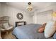 Comfortable bedroom featuring a decorative mirror, a comfortable rattan chair, and an area rug at 3061 Beach Palm Ave, Kissimmee, FL 34747