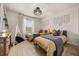 Bright bedroom featuring two twin beds, decorative macrame wall hangings, and a charming tent at 3061 Beach Palm Ave, Kissimmee, FL 34747