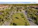 Aerial view of the community with lush landscaping, mature trees and a clubhouse at 3061 Beach Palm Ave, Kissimmee, FL 34747