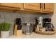 Neutral kitchen countertops offer ample space with modern appliances and a touch of greenery at 3061 Beach Palm Ave, Kissimmee, FL 34747