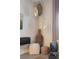 Interior design featuring wicker lamps hanging above boho furniture and decor against a neutral painted wall at 3061 Beach Palm Ave, Kissimmee, FL 34747