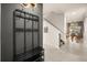 Chic entryway featuring a coat rack and shoe storage, flowing into bright living area at 3061 Beach Palm Ave, Kissimmee, FL 34747
