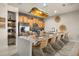 Bright kitchen with modern appliances, a large island, and wicker dining chairs at 3061 Beach Palm Ave, Kissimmee, FL 34747