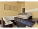 Lanai area showcasing a grill, outdoor seating and decorative wall art, perfect for entertaining at 3061 Beach Palm Ave, Kissimmee, FL 34747