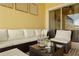 Relaxing lanai area with comfortable seating, a ceiling fan and stylish decor for outdoor living at 3061 Beach Palm Ave, Kissimmee, FL 34747