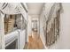 Bright laundry room hallway featuring a washer and dryer with stylish decor at 3061 Beach Palm Ave, Kissimmee, FL 34747