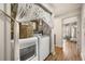 Bright laundry room area featuring a washer and dryer with stylish decor at 3061 Beach Palm Ave, Kissimmee, FL 34747