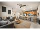 Open concept living space with modern furnishings, adjacent kitchen, and dining area, perfect for entertaining at 3061 Beach Palm Ave, Kissimmee, FL 34747