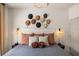 Comfortable main bedroom featuring a decorative headboard and stylish bedside lighting at 3061 Beach Palm Ave, Kissimmee, FL 34747