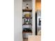 Charming shelving nook with a blender, basket and other kitchen appliances at 3061 Beach Palm Ave, Kissimmee, FL 34747